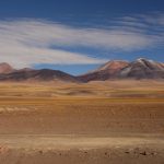 In 3000+m height, the vegetation comes back in a small yellowish form - but still beautiful with the colored mountains and the blue sky.