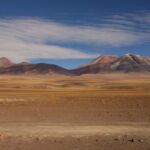 In 3000+m height, the vegetation comes back in a small yellowish form - but still beautiful with the colored mountains and the blue sky.