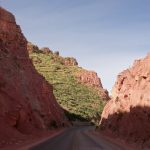 Red rock - green grass. Fantastic scenery to drive through. You also have to appreciate the (Bolivian) work that went into digging a way through this rock :-)